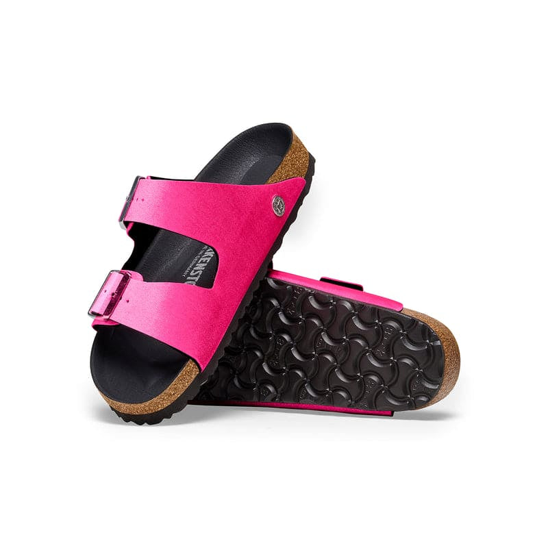 Birkenstock Women's Arizona Sandals in bright pink with rivet buckles and smooth black footbed, top view.