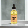 Bottle of Moscato, Peach + Pineapple Bath + Body Oil, perfect for luxurious baths and moisturizing skin.