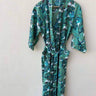 Bohemian pure cotton banana leaf kimono bath robe hanging, featuring a vibrant green floral print and handcrafted design.