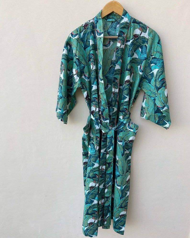 Bohemian pure cotton banana leaf kimono bath robe hanging, featuring a vibrant green floral print and handcrafted design.