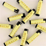 Collection of PATISSERIE Lemon Gelato Lip Balm tubes, made in Canada, featuring vibrant yellow packaging.