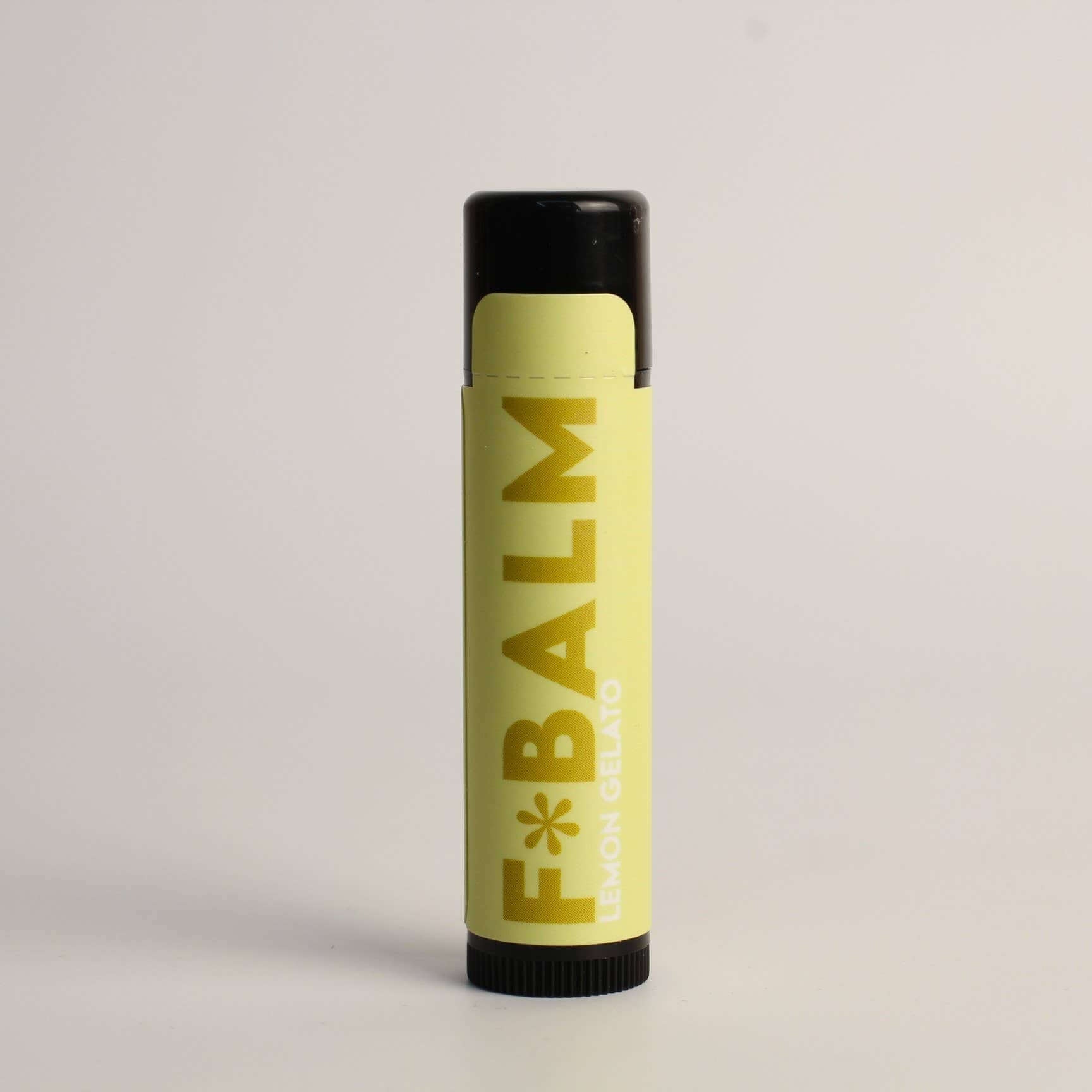 PATISSERIE Lemon Gelato Lip Balm in yellow packaging, made in Canada, natural ingredients for silky lips.