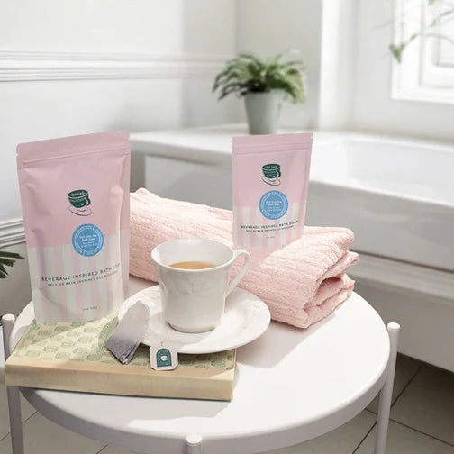 Midnight Paloma Earl Grey Tea Bath Soak Epsom Soak next to a bathtub