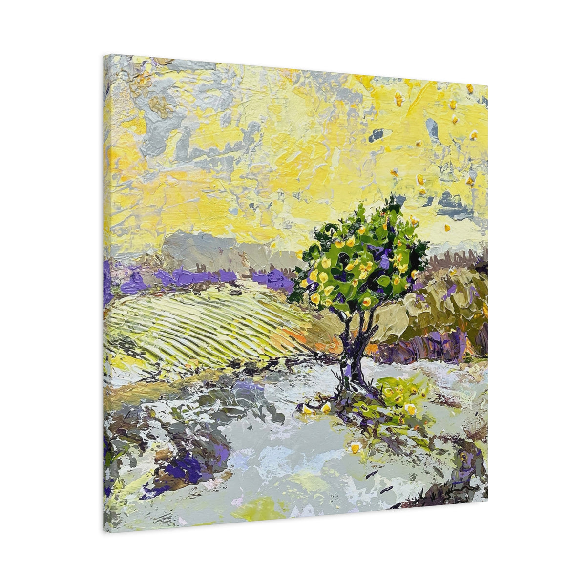Square canvas wall art featuring an impressionistic landscape painting with a green tree, lavender fields, and a bright yellow sky, shown at an angle against a white background.