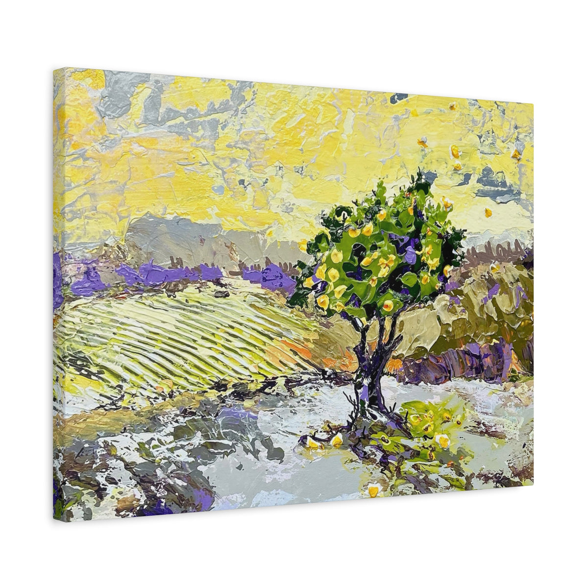 A square canvas wall art print featuring an impressionistic landscape painting of a green tree in a field with purple lavender rows under a bright yellow sky, shown at an angle on a white background.