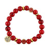 Red Howlite Happiness Bracelet with gold accents on a white background