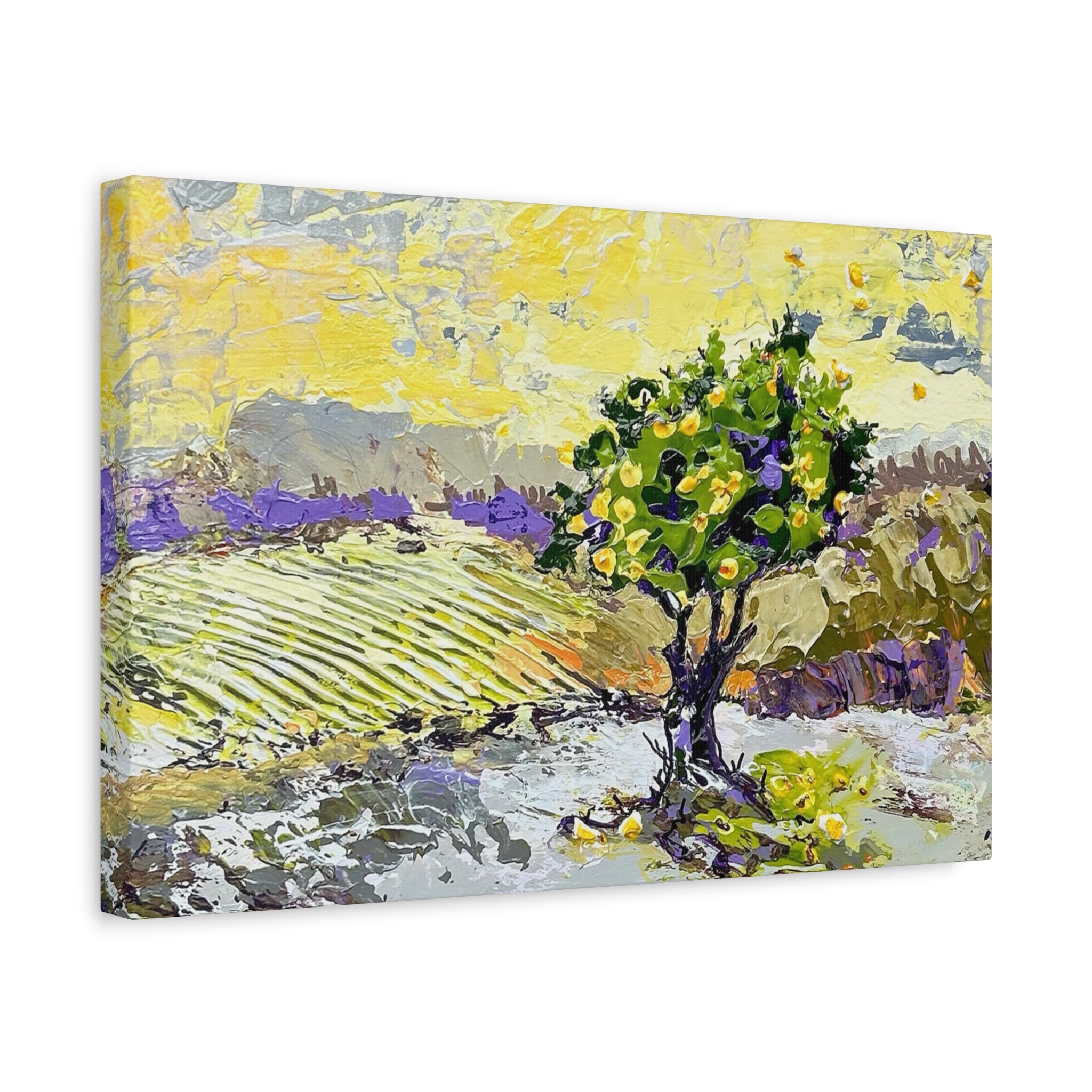 A rectangular canvas wall art print showing an impressionistic landscape painting with a green tree in the foreground, yellow sky, and purple fields, photographed against a plain white background.