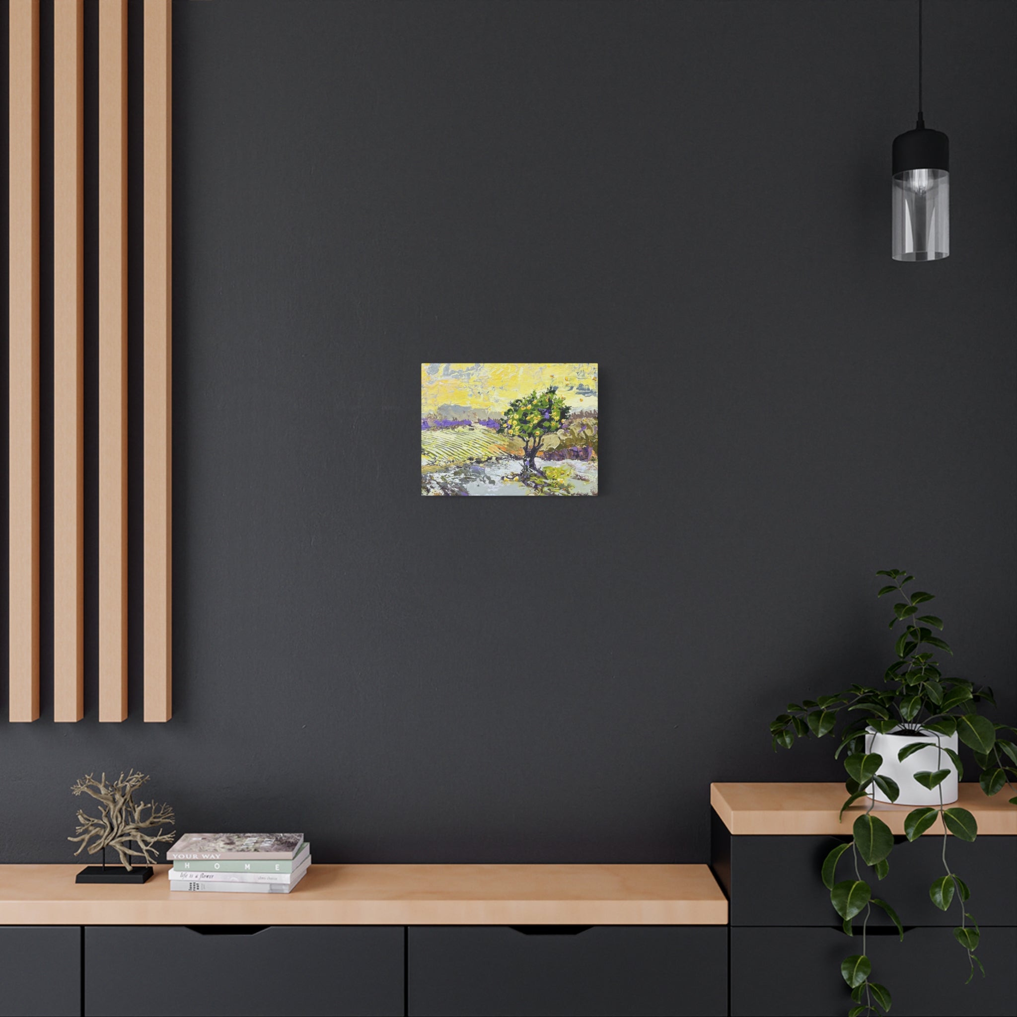 Modern interior with a dark wall, wooden shelf, and framed artwork.