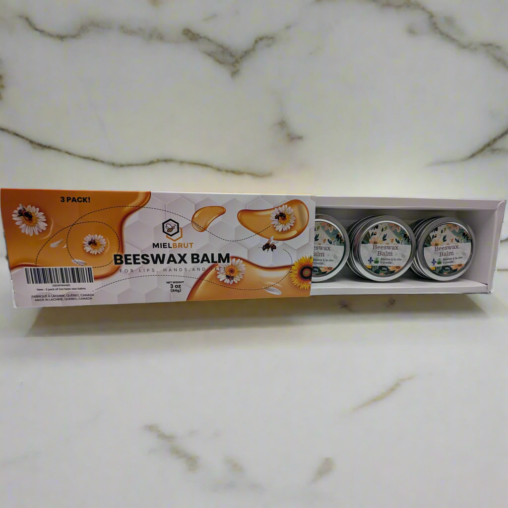 Miel Brut Beeswax Balm packaging on a marble surface