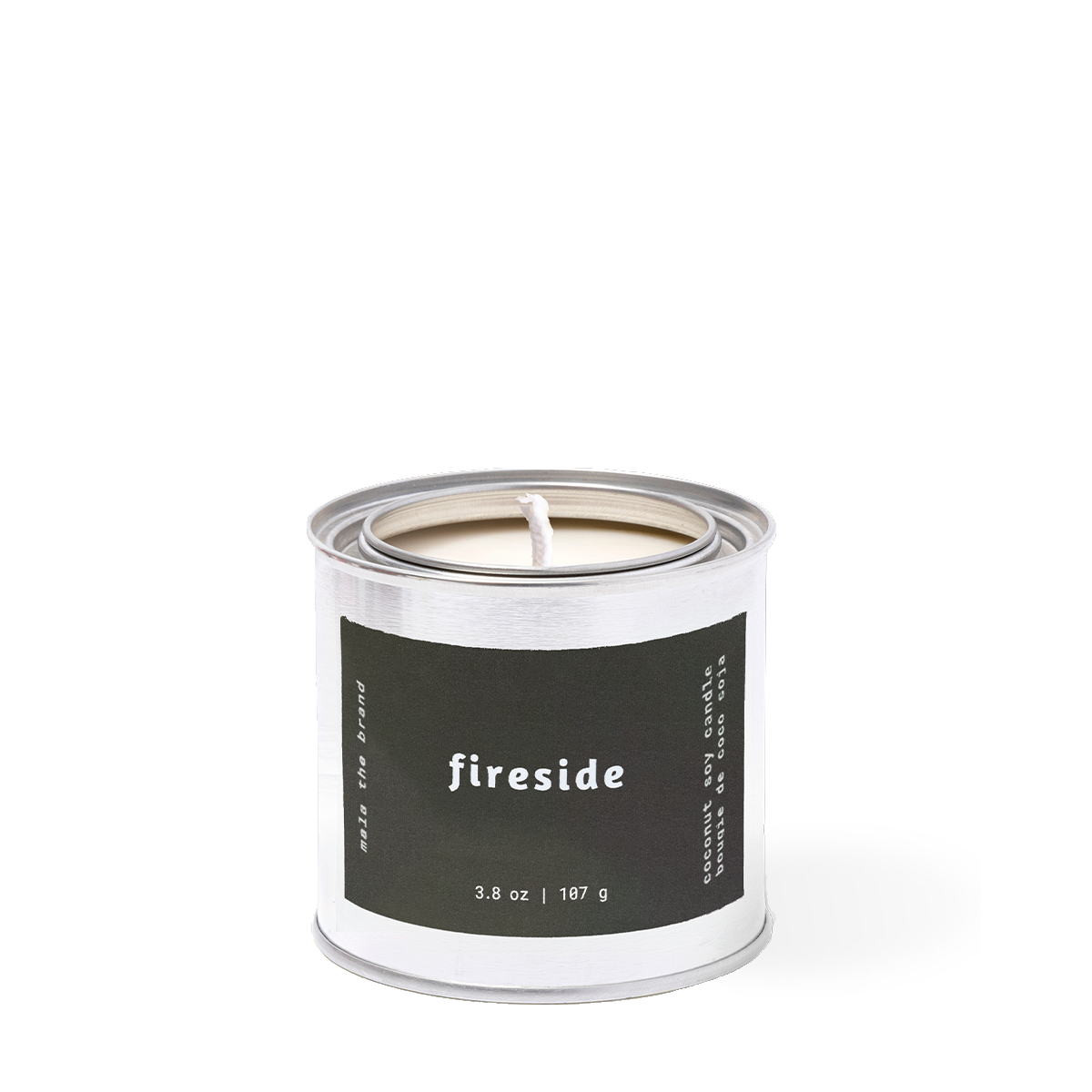 Candle in a tin labeled 'fireside' on a white background