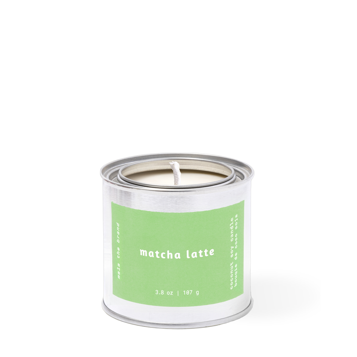 Candle in a metal tin with a green label on a white background