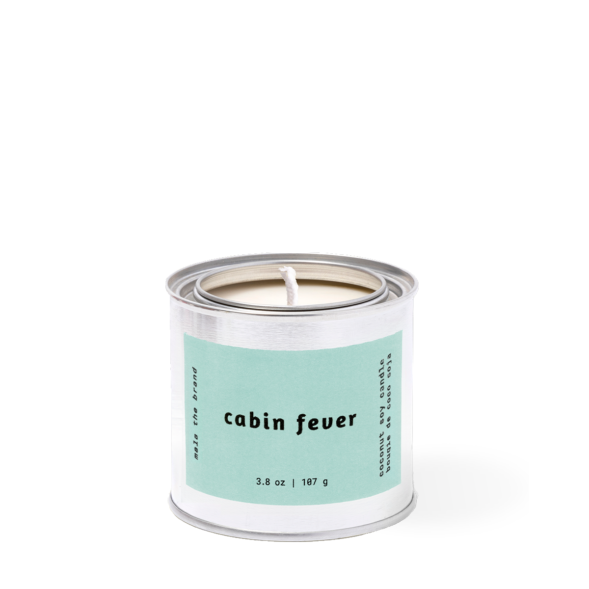 Candle in a metal can labeled 'cabin fever' on a white background