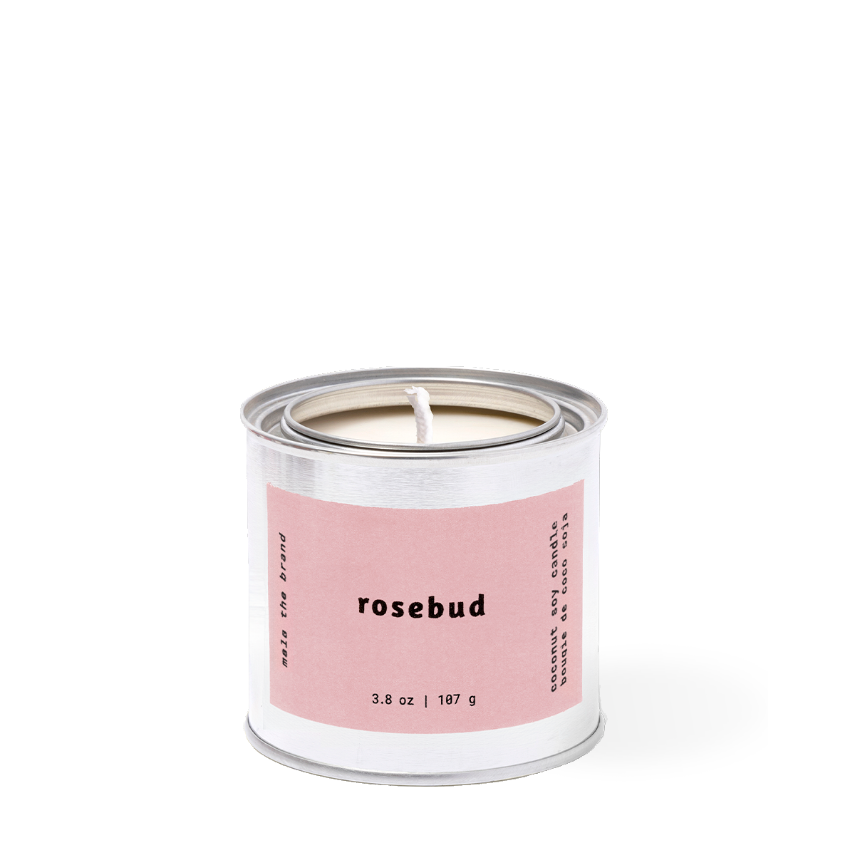 Candle in a metal tin with a pink label on a white background