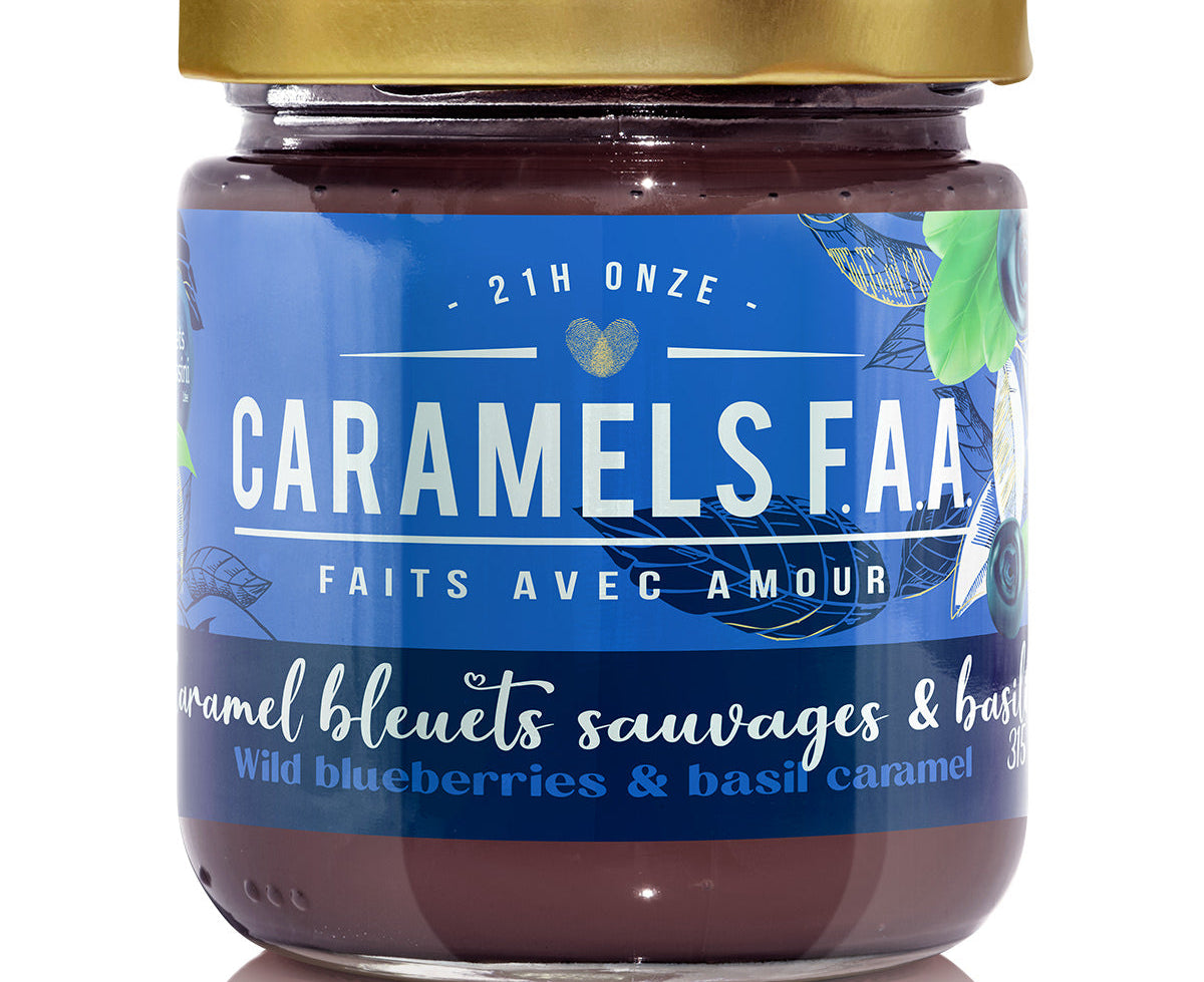 Jar of Caramels F.A.A. with a blue label and gold lid on a white background