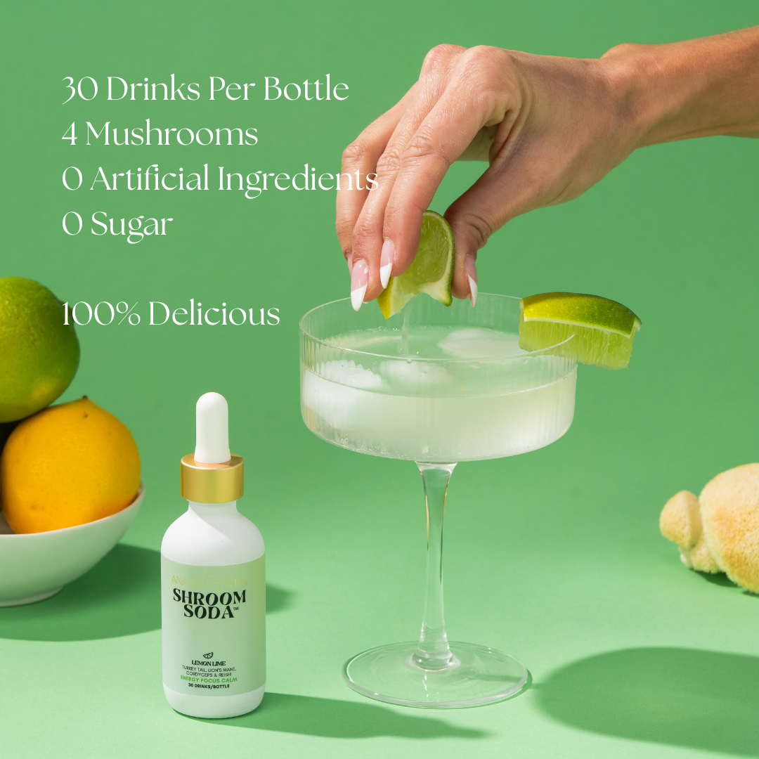 Shroom Soda bottle with a cocktail and lime on a green background