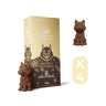 Chocolate cat figurines with packaging on a black background
