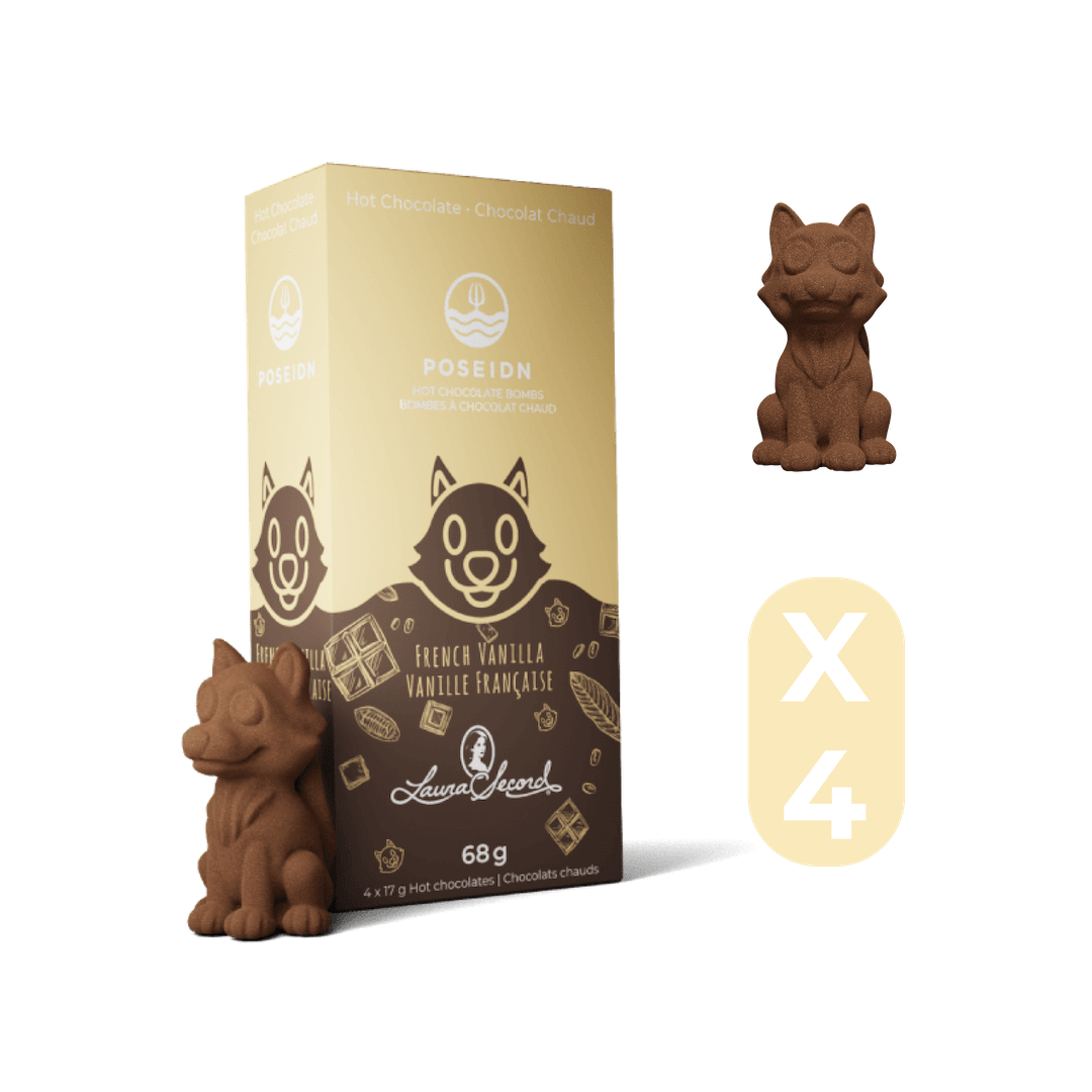 Chocolate cat figurines with packaging on a black background