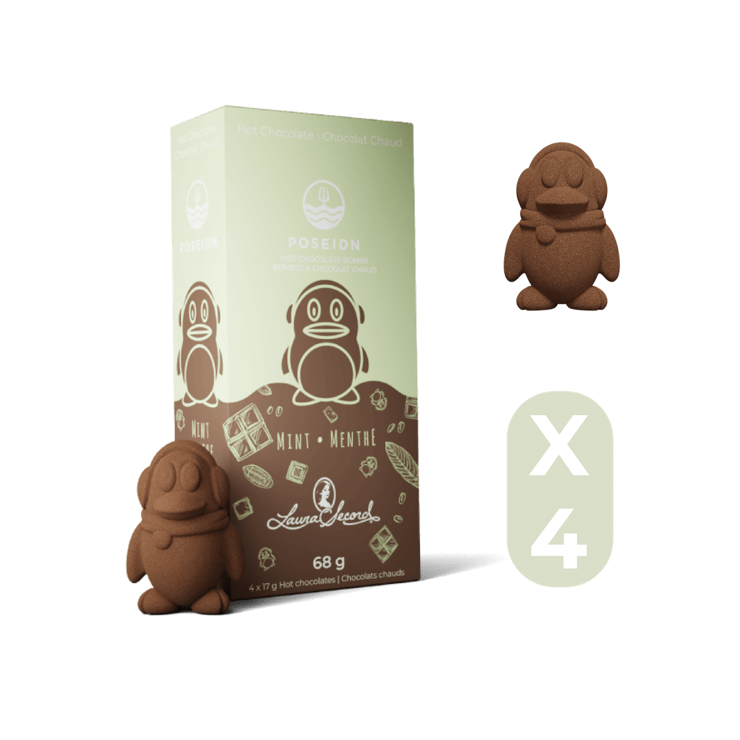 Box of hot chocolate with two penguin-shaped chocolate pieces on a black background