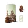 Box of hot chocolate with two penguin-shaped chocolate pieces on a black background