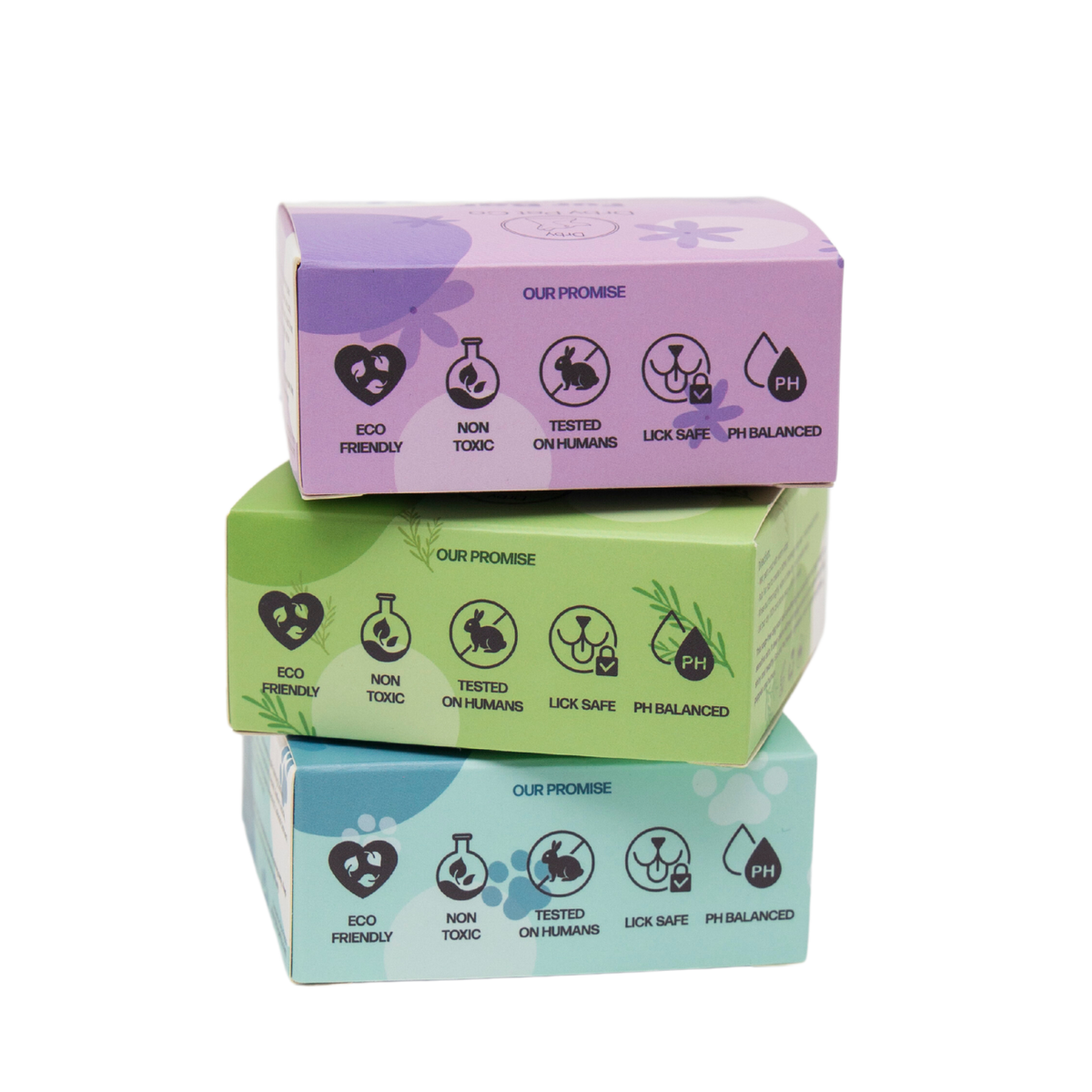 Three stacked boxes with purple, green, and blue lids on a white background