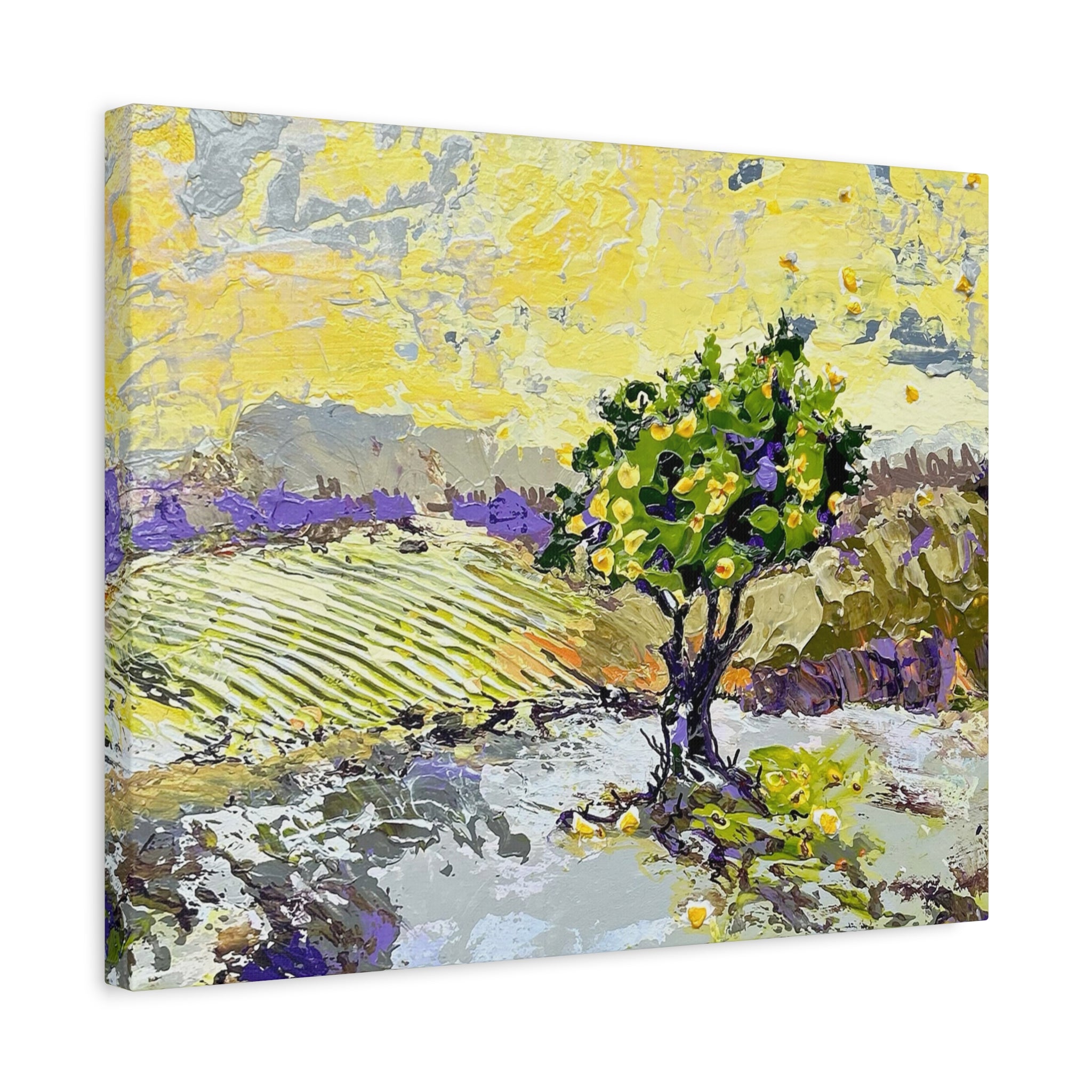 An impressionistic canvas wall art print depicting a landscape with a green tree, yellow sky, and purple fields, shown at an angle on a white background.