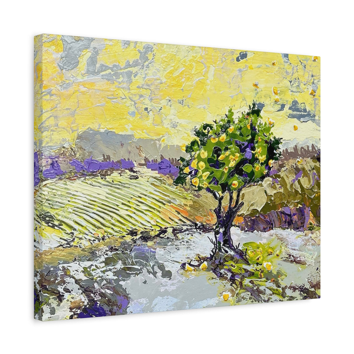 An impressionistic canvas wall art print depicting a landscape with a green tree, yellow sky, and purple fields, shown at an angle on a white background.