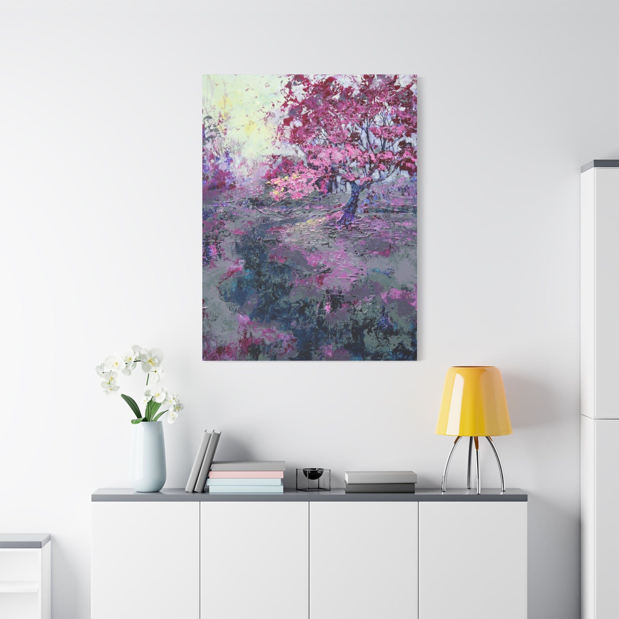 Nancy Overbury canvas print – Heather of the Rocks – pink flowering tree hanging on a wall over a desk and yellow lamp