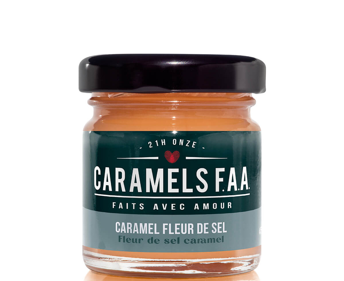 Jar of Caramels F.A.A. with a black lid on a white background