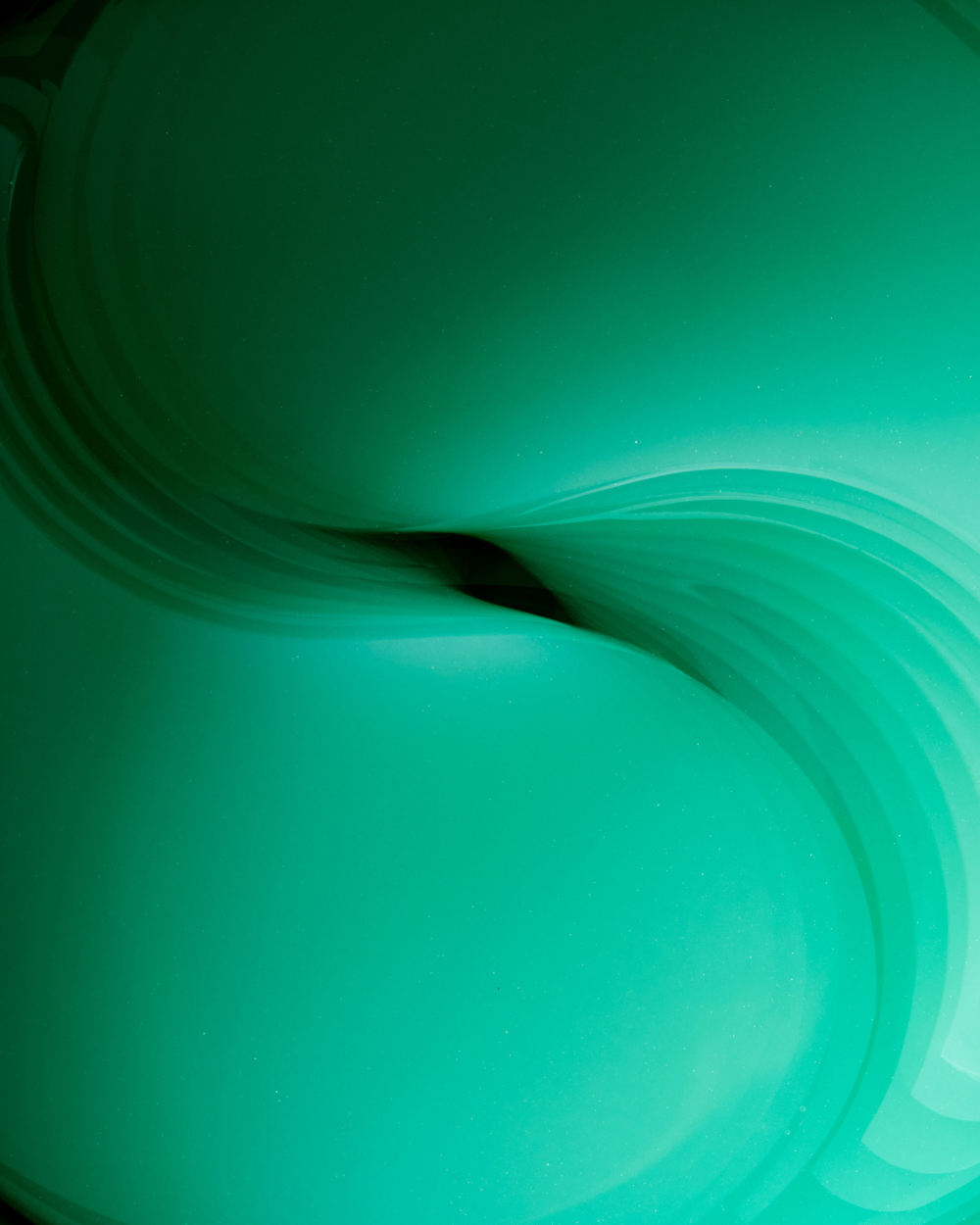 Abstract green wave pattern symbolizing hydration and freshness, perfect for beauty product imagery.