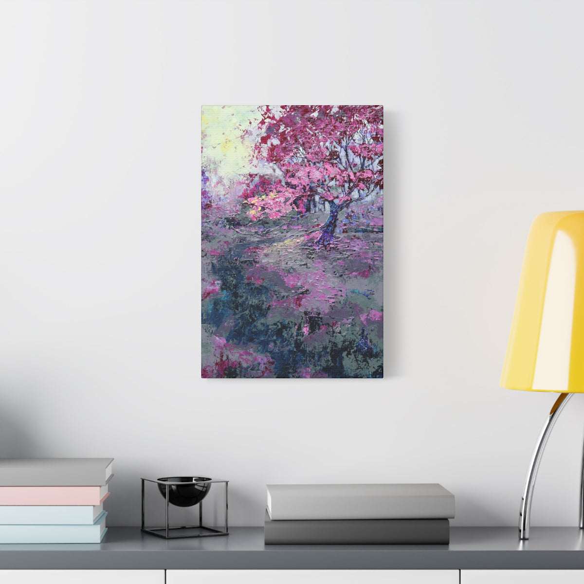 Nancy Overbury canvas print – Heather of the Rocks – pink flowering tree hanging on a wall over a desk and yellow lamp