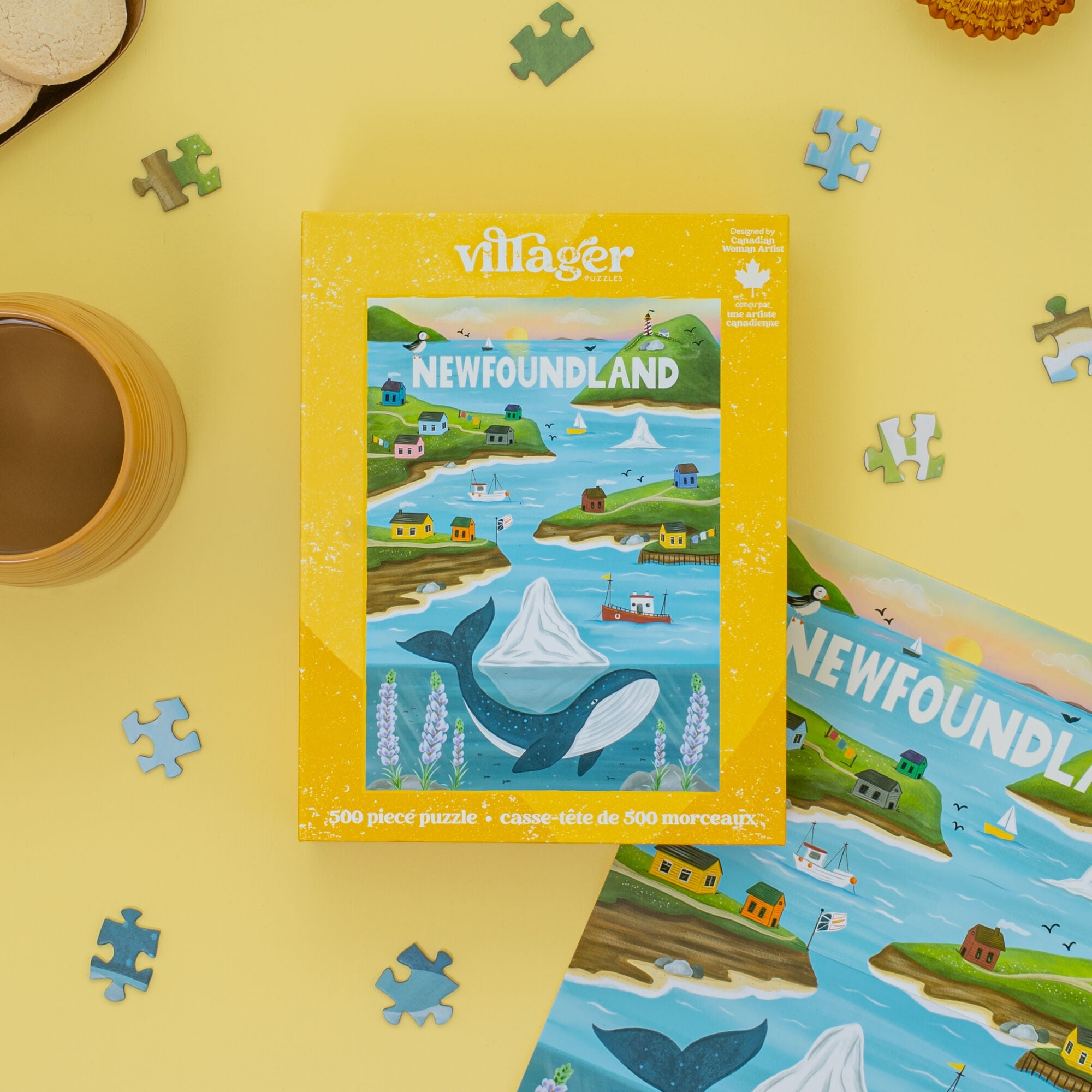 Villager Newfoundland puzzle box on a yellow surface with puzzle pieces.