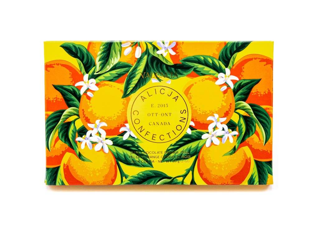 Vibrant packaging of ALICJA SNOW dark chocolate featuring oranges and white flowers, Canadian confectionery, vegan-friendly