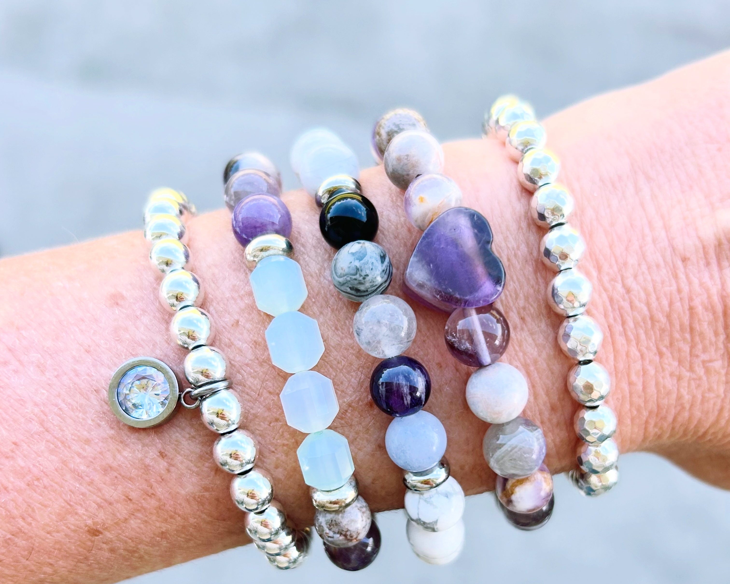 Healing Stack, thoughtfully designed to combine the natural beauty of powerful gemstones: Amethyst, Onyx, Jade, Jasper, Howlite, Hematite and Quartz.