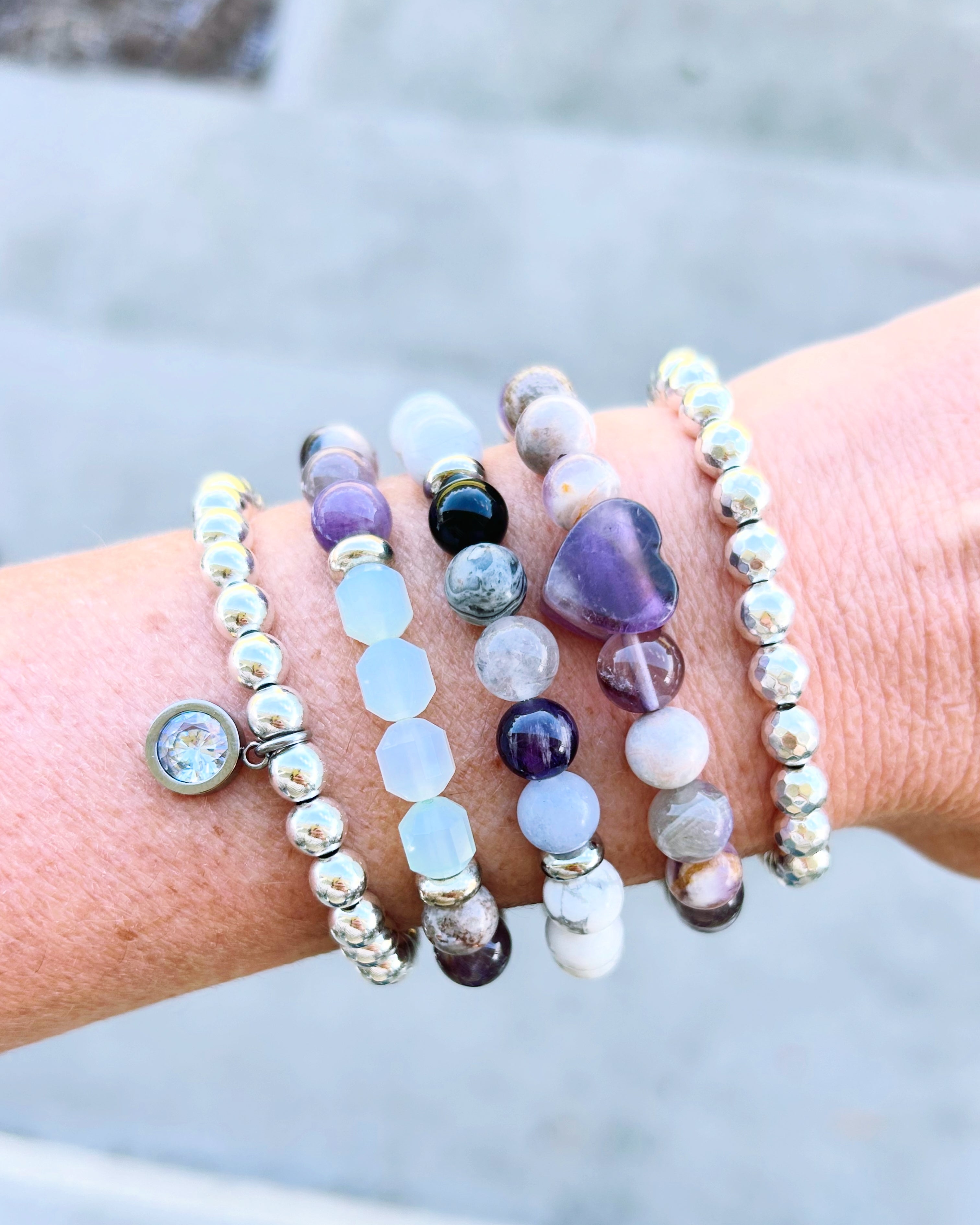 Healing Stack, thoughtfully designed to combine the natural beauty of powerful gemstones: Amethyst, Onyx, Jade, Jasper, Howlite, Hematite and Quartz.