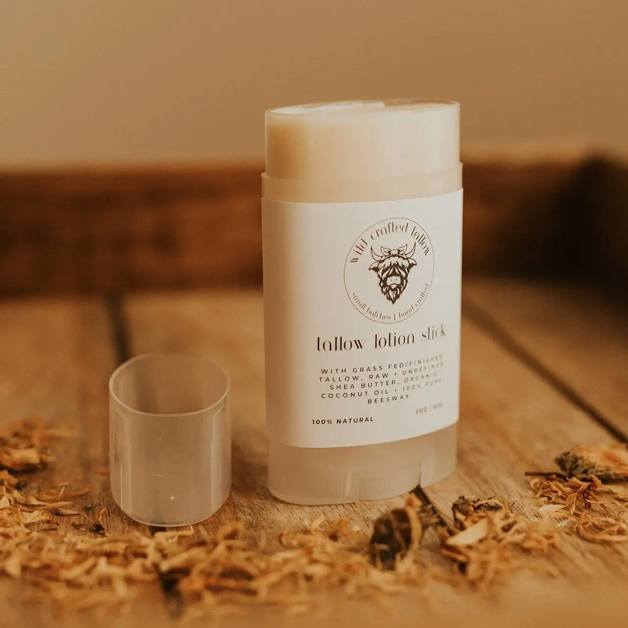 Lotion stick on a wooden surface with natural elements