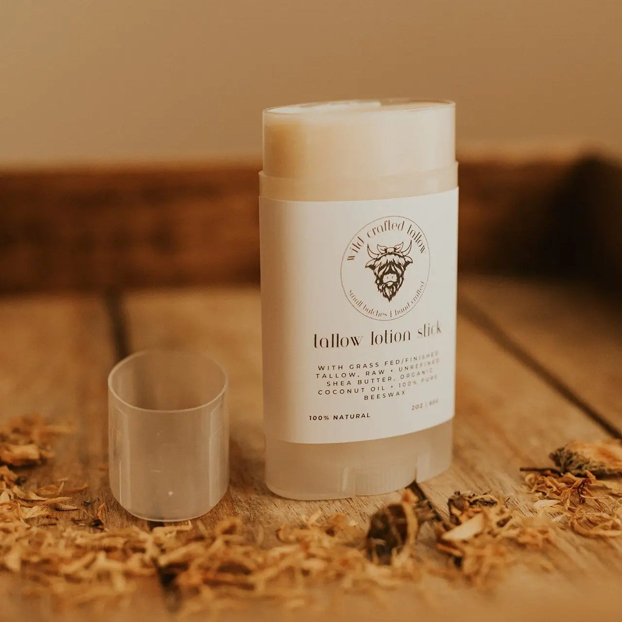 Lotion stick on a wooden surface with natural elements