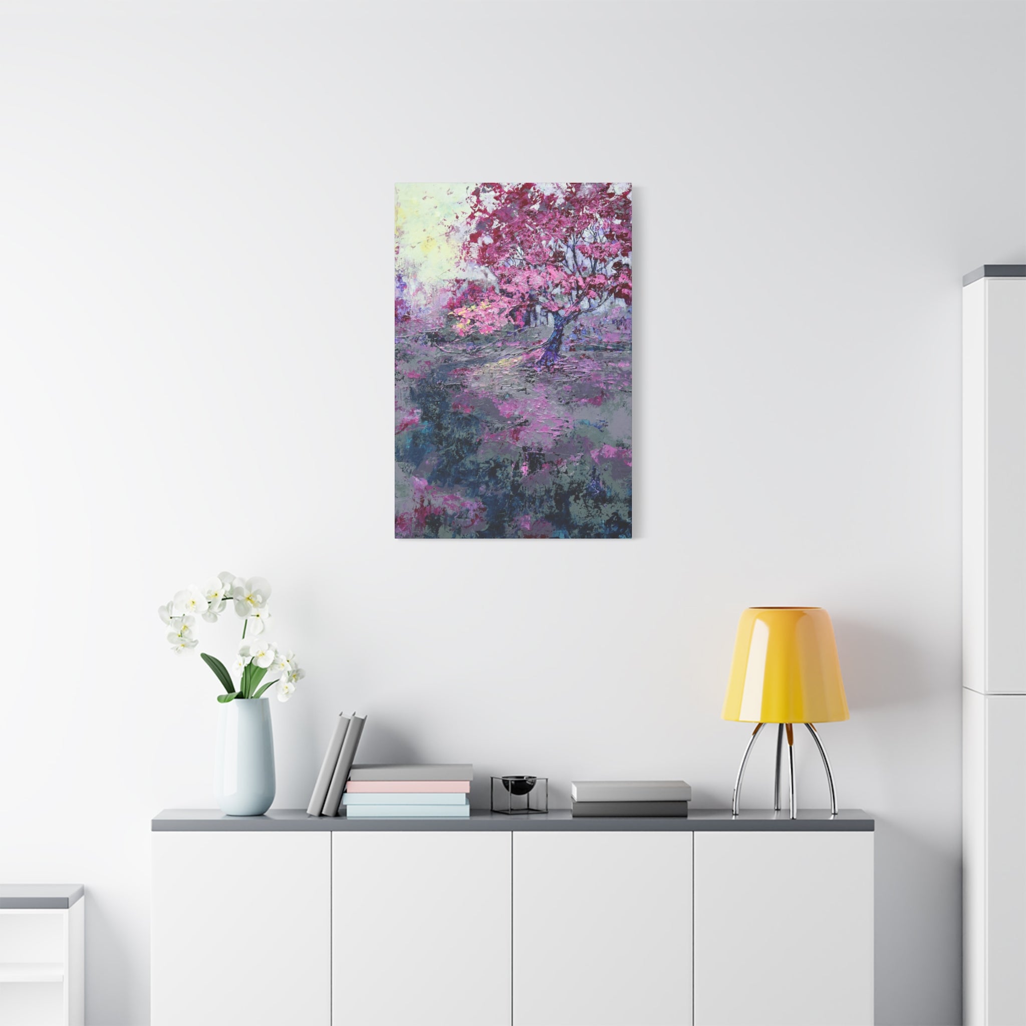 Nancy Overbury canvas print – Heather of the Rocks – pink flowering tree hanging on a wall over a desk and yellow lamp