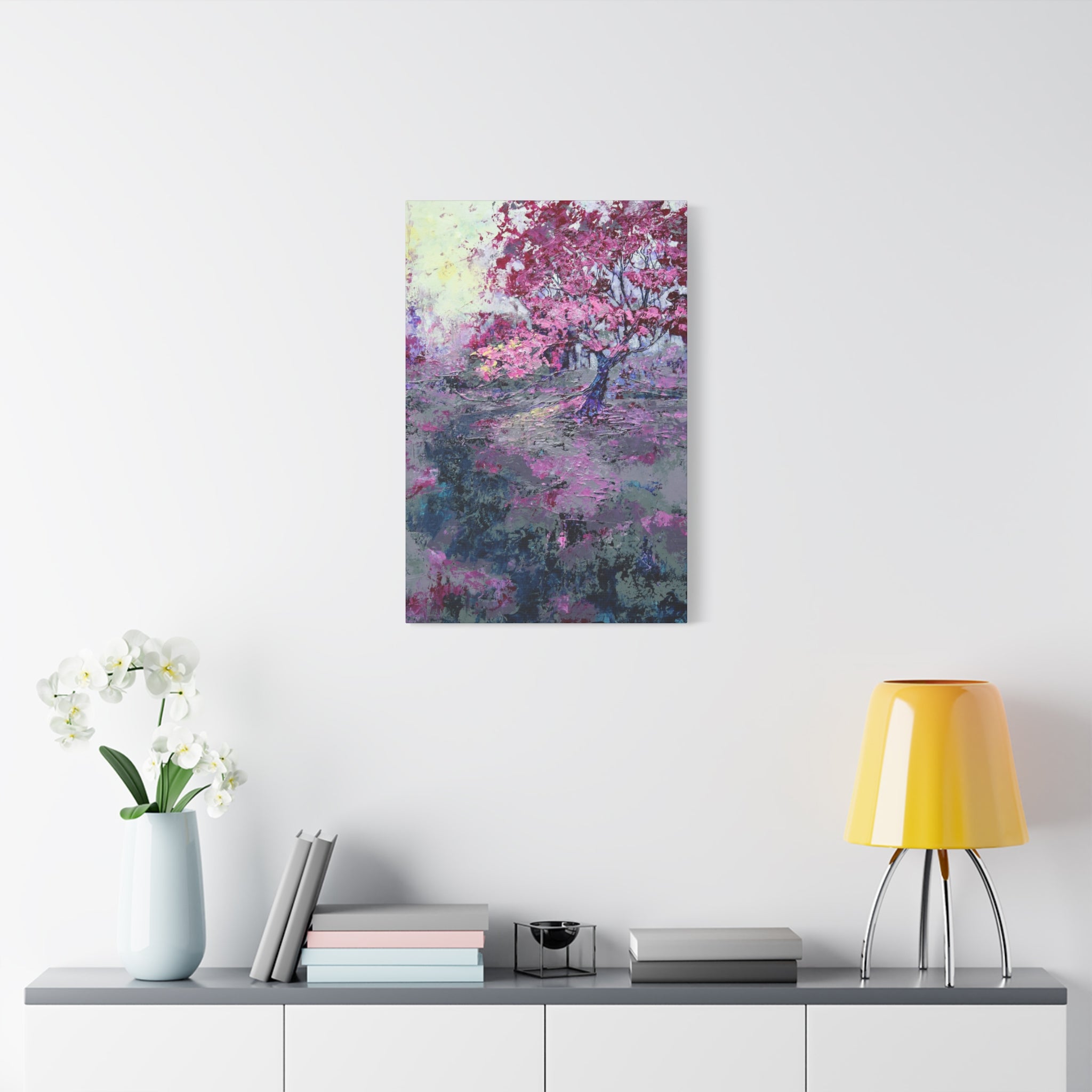 Nancy Overbury canvas print – Heather of the Rocks – pink flowering tree hanging on a wall over a desk and yellow lamp