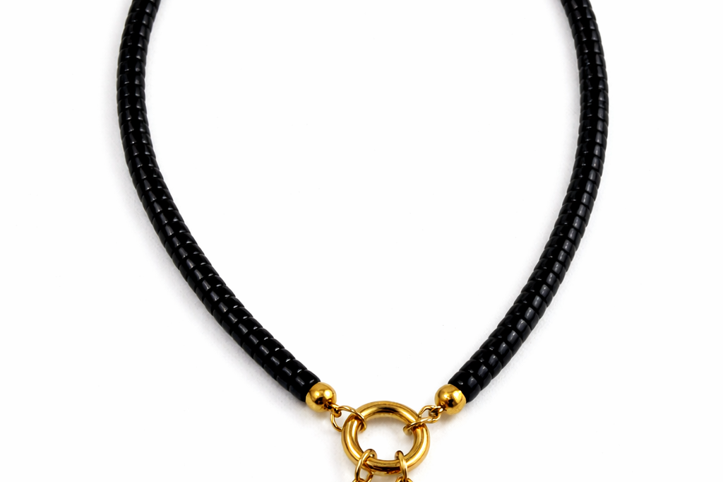 Moonrise Necklace - Onyx necklace with gold moon and star pendant on a white background by Six N Stones