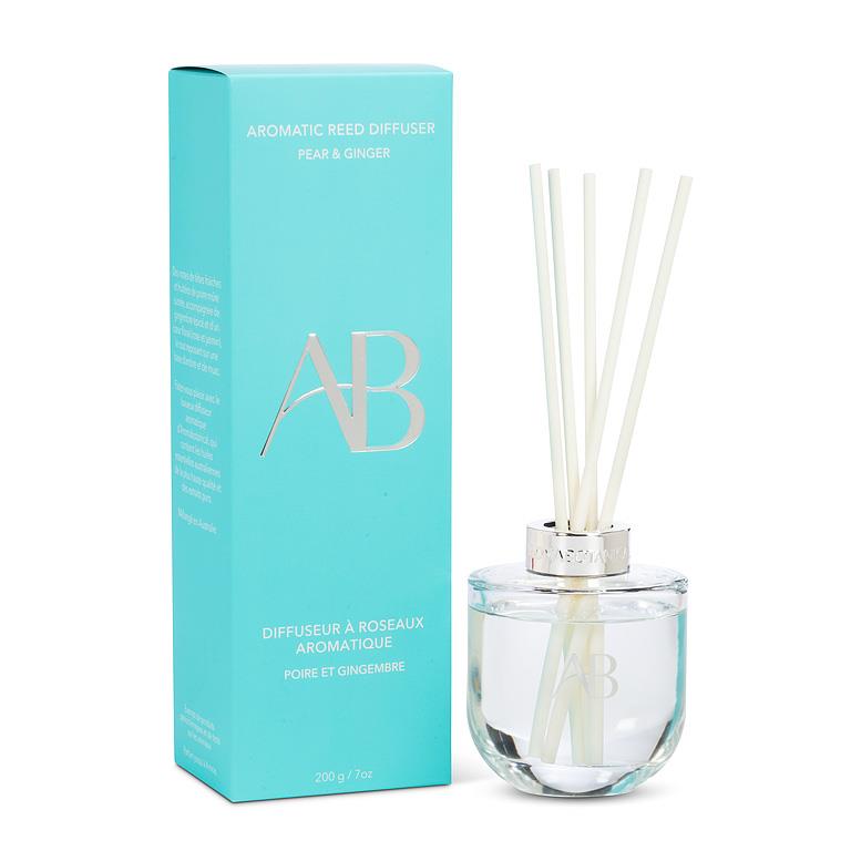 Aromatic reed diffuser with packaging on a white background