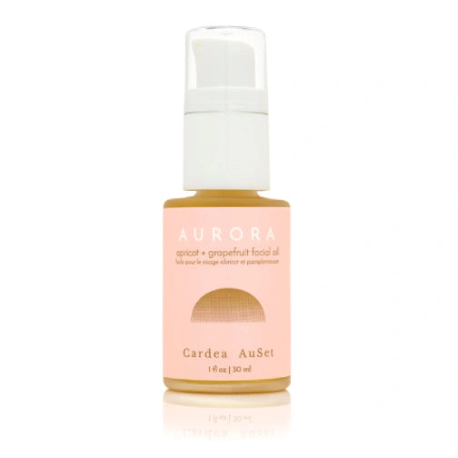 Aurora Cardea AuSet facial Oil with a white cap on a light pink background