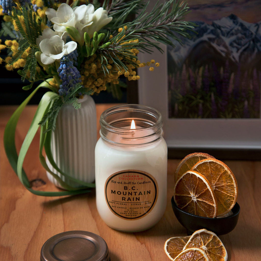 Candle with decorative elements on a wooden surface