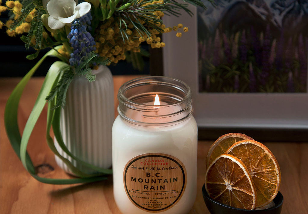 Candle with decorative elements on a wooden surface