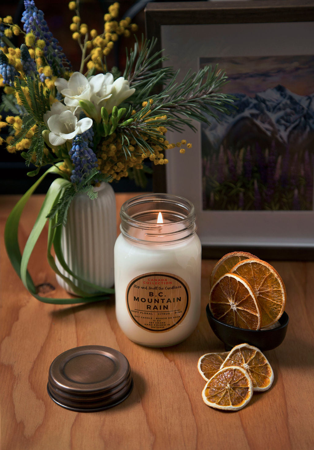 Candle with decorative elements on a wooden surface