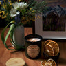 Stopandsmellthecandles BC Mountain Rain soy candle – 8 oz black jar with lit wooden wick, wooden lid, flowers and dried citrus