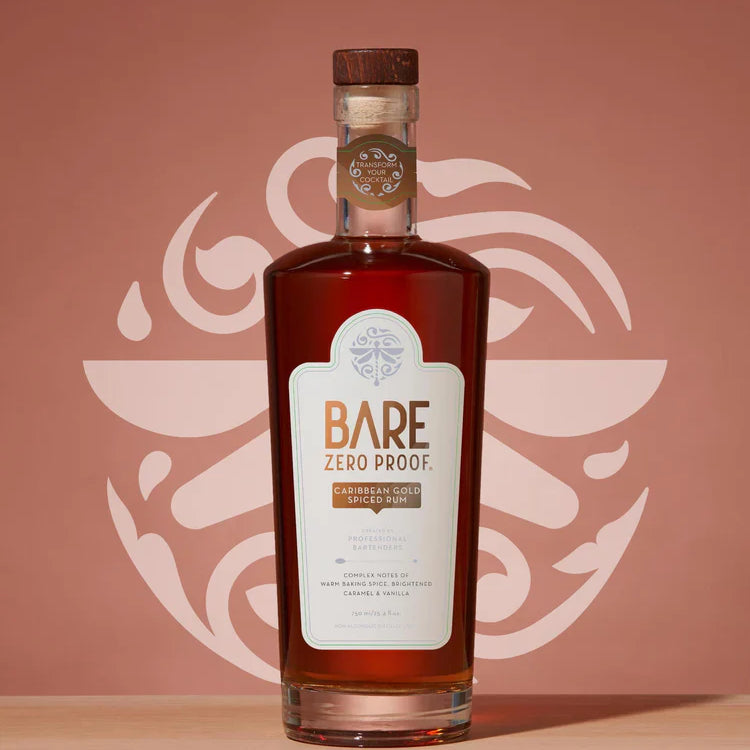 Bottle of Bare Zero Proof alcohol on a wooden surface with a decorative pink background  The Sobr Market