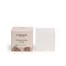 Cocoon Apothecary Spruce Flora bath cake with packaging on a white background