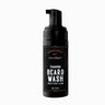 Black foam bottle of foaming beard wash with 'First Element' branding on a white background