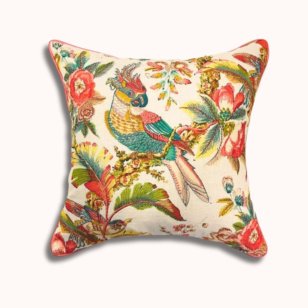 Decorative pillow with parrot and floral pattern on a white background