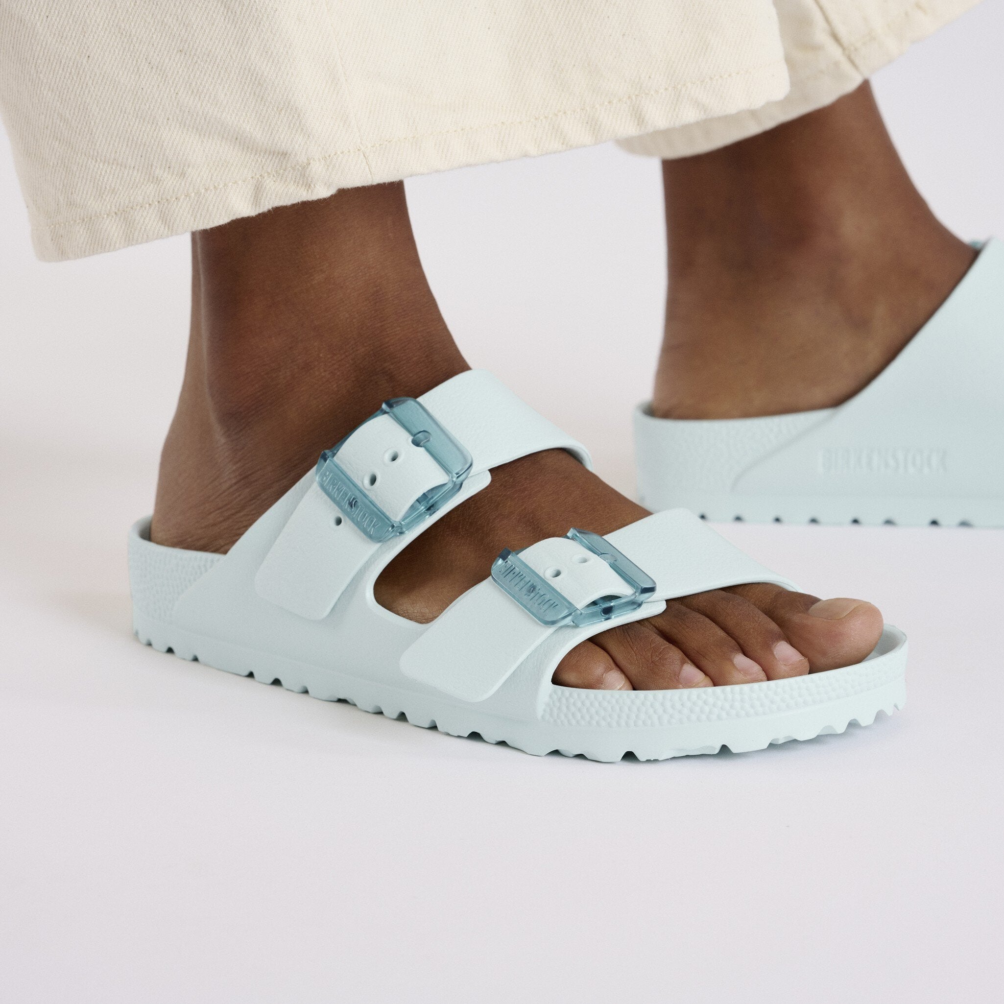 Birkenstock Arizona Stealth EVA Surf Green Sandals worn on a model's feet, ideal for casual and water-friendly use.